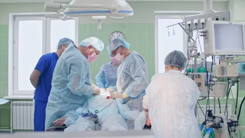 The surgeon performs a surgical operation Stock Footage 150885833