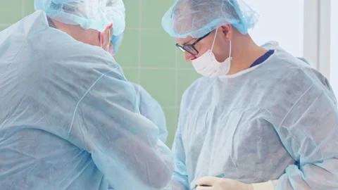 The surgeon performs a surgical operation Stock Footage 150886205
