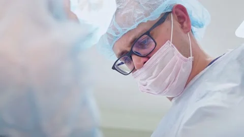 The surgeon performs a surgical operation Stock Footage 150887513