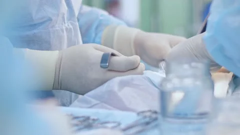 The surgeon performs a surgical operation Stock Footage 150888444