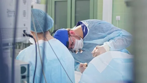 The surgeon performs a surgical operation Stock Footage 150888774