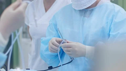The surgeon performs a surgical operation Stock Footage 150889377