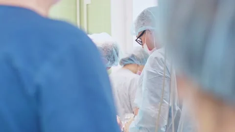 The surgeon performs a surgical operation Stock Footage 150889521