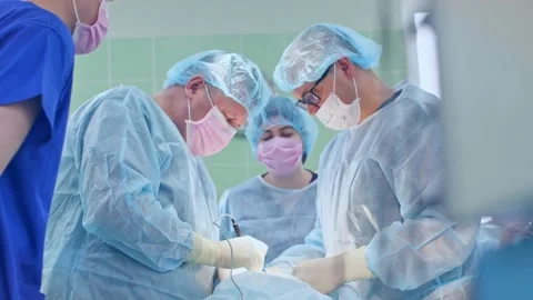 The surgeon performs a surgical operation Stock Footage 150889908