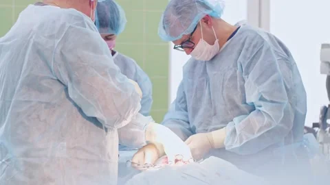 The surgeon performs a surgical operation Stock Footage 150890023