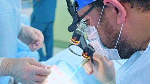 The surgeon performs a surgical operation Stock Footage 150890439