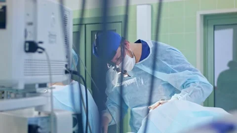 The surgeon performs a surgical operation Stock Footage 150890462