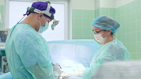 The surgeon performs a surgical operation Stock Footage 150890753