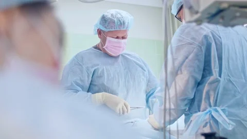 The surgeon performs a surgical operation Stock Footage 150890867