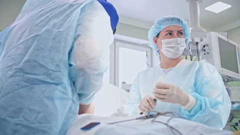 The surgeon performs a surgical operation Stock Footage 150890913