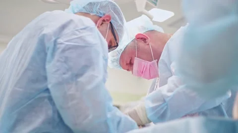 The surgeon performs a surgical operation Stock Footage 150890958