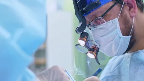 The surgeon performs a surgical operation Stock Footage 150891318