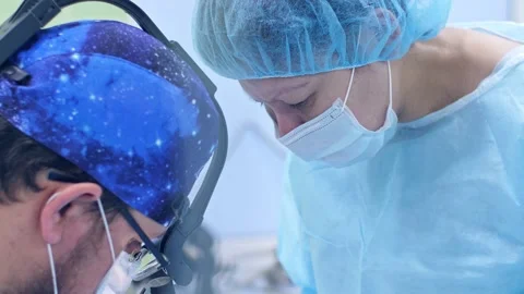 The surgeon performs a surgical operation Stock Footage 150891450