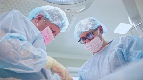 The surgeon performs a surgical operation Stock Footage 150891788
