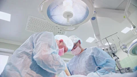 The surgeon performs a surgical operation Stock Footage 150891861