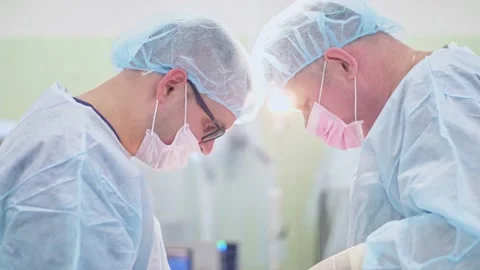 The surgeon performs a surgical operation Stock Footage 150891892