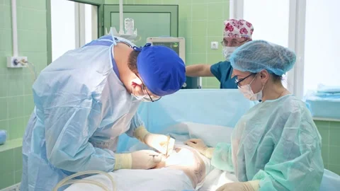 The surgeon performs a surgical operation Stock Footage 150892022