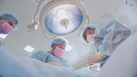 The surgeon performs a surgical operation Stock Footage 150892098