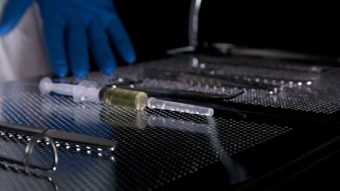 The surgeon prepares the scalpel on the table with the tools for the operation Stock Footage 81008734