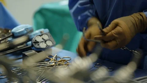 Surgeon preparing his equipment Stock Footage 85932968