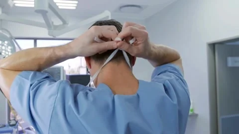 Surgeon Preparing Mask in Operating Room Stock Footage 307585676