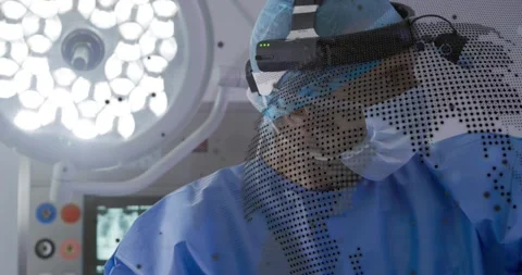 Surgeon pulling drape donning headlamp scanning X-rays with code overlay for Stock Footage 325771714