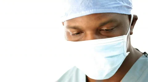 Surgeon pulls down face mask, delivers bad news. Stock Footage 306074