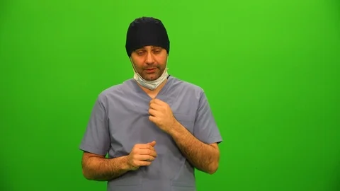 Surgeon Pulls Down Face Mask, Delivers Bad News Stock Footage 88652522