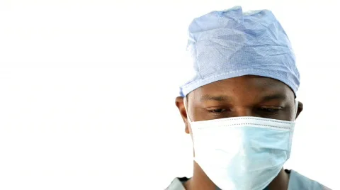 Surgeon pulls down facemask and gives good news. 스톡 동영상 306085