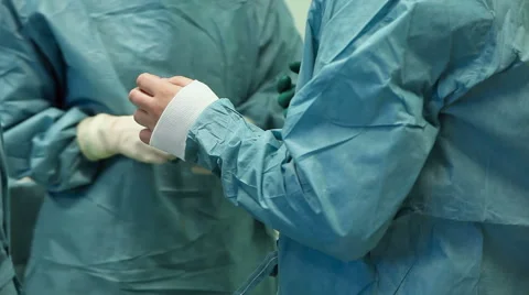 Surgeon put on gloves before the operation Stock Footage 52712492