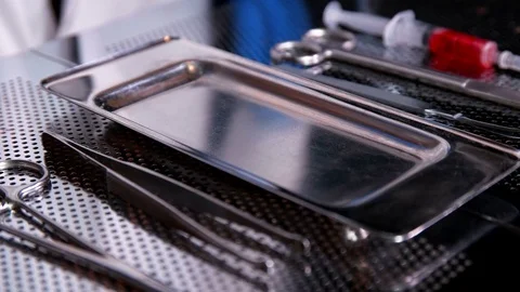 The surgeon puts a flash chip on the tray after surgery Stock Footage 80980930