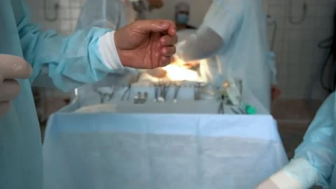 The surgeon puts on gloves before the operation Stock Footage 194508281