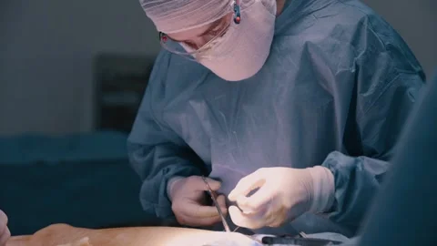 The surgeon puts stitches Stock Footage 270218212