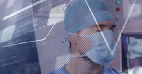 Surgeon scanning translucent display as data updates, overlaid line graphs Stock Footage 330540631