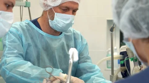 Surgeon skillfully operates on the patient Stock Footage 311990838