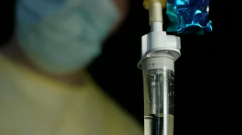 Surgeon Soft Focus IV Dripping in Foreground Video stock 12568632