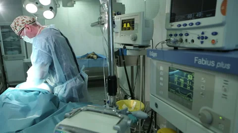 Surgeon in surgery room during operation. Surgeon operating. Stockbeeldmateriaal 61174655