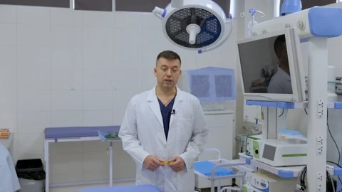 Surgeon talking directly to the camera in a operating room. Stock Footage 107604552