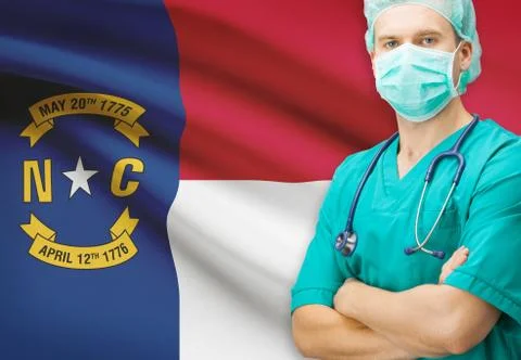 Surgeon with US state flag on background - North Carolina Stock Photos