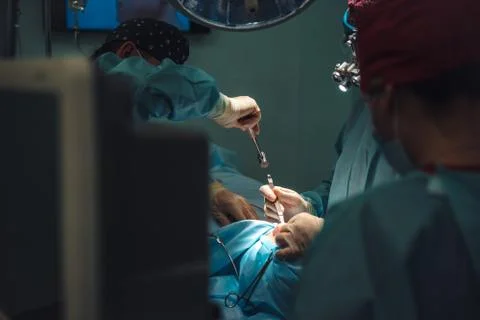 The surgeon uses a chisel and a hammer Stock Photos