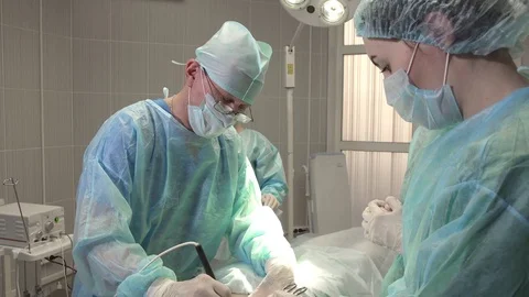 Surgeon uses an electronic scalpel during surgery Stock Footage 84787571