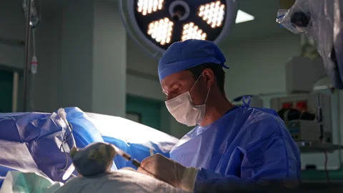 Surgeon uses metal tools at operation on hand. Stock Footage 296744603