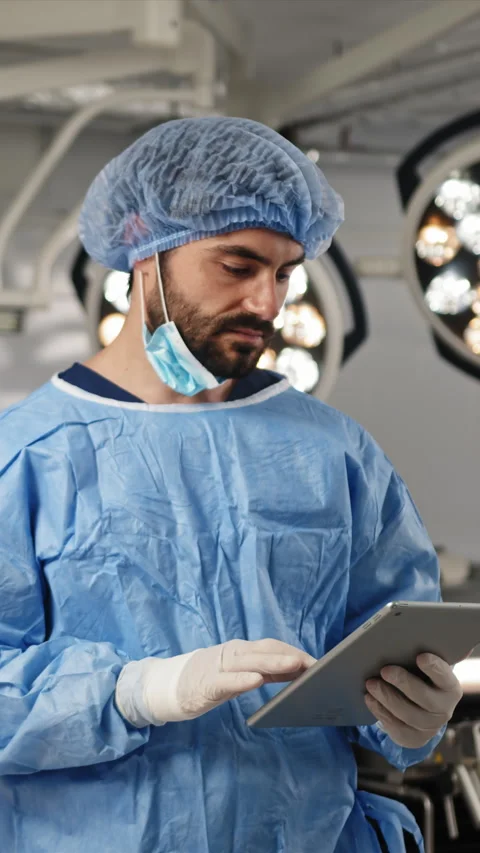 Surgeon Using Tablet In Operating Room Stock Footage 316182029