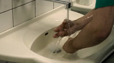 Surgeon washes his hands Stock Footage 61628715