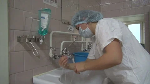 The surgeon washes his hands Stock Footage 155534267