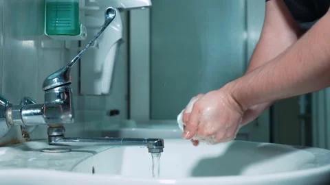 A surgeon washes his hands before surgery, disinfection of the doctor's hands Stock Footage 220521902