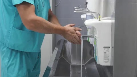 Surgeon Washing Hands Before Operating Stock Footage 147321441
