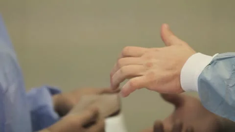 Surgeon Wears gloves Stock Footage 288298441
