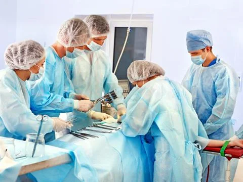 Surgeon at work in operating room. Stock Photos