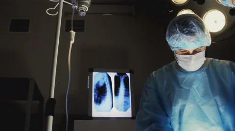 Surgeon At Work With A Team Of Colleagues Video stock 64964636